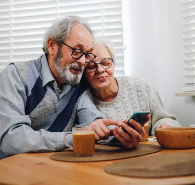 Elderly Couple using a smartphone designed for seniors