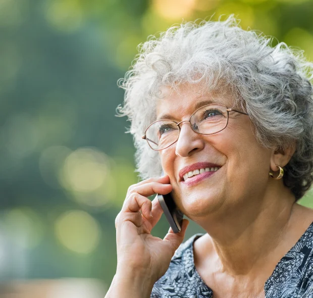 Elderly Lady using a smartphone designed for seniors